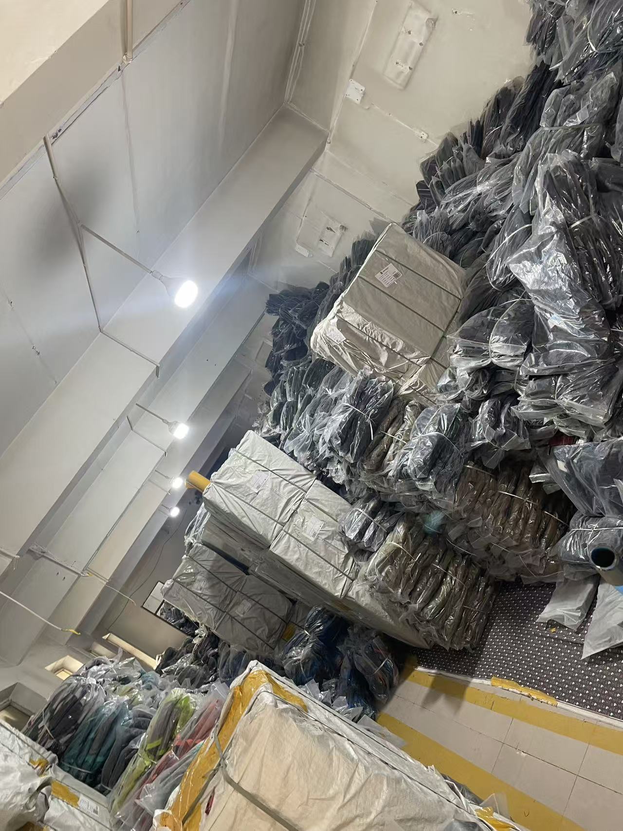 KalunStyles backpacks and handbags in factory storage
